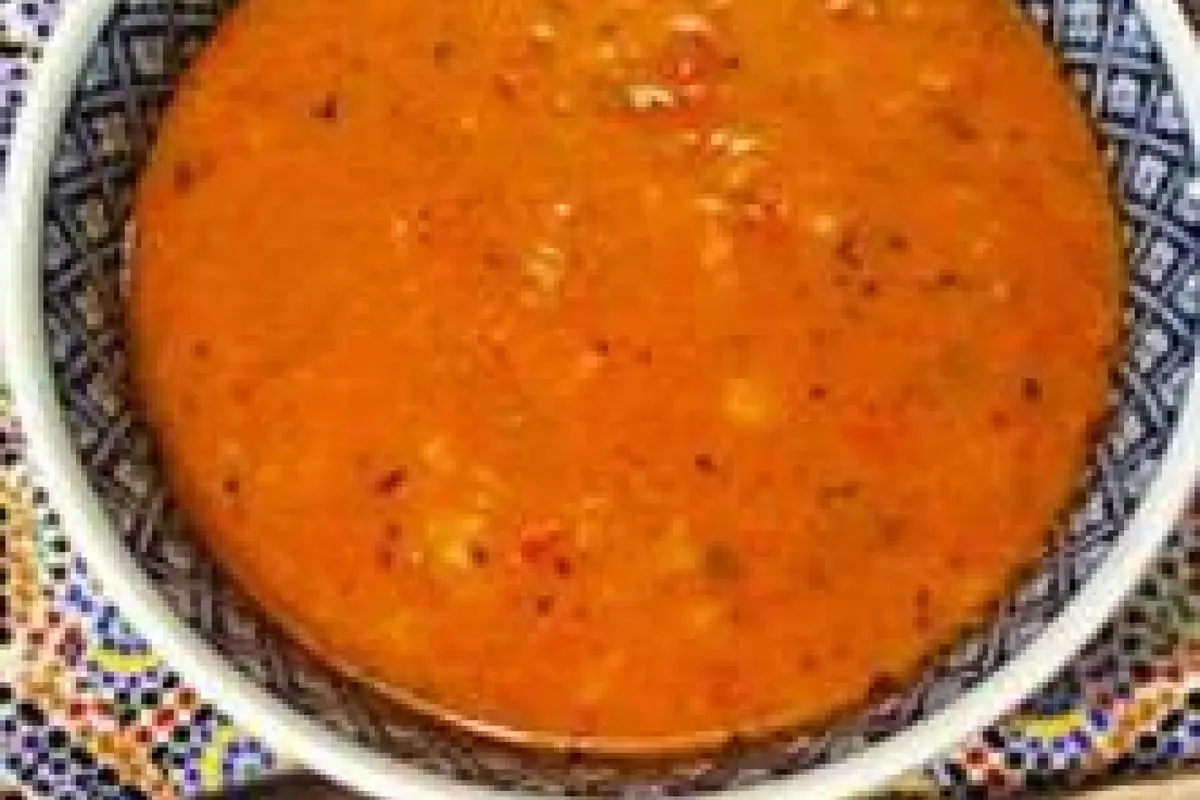 A bowl of Moroccan harira soup with lentils, chickpeas and fresh herbs