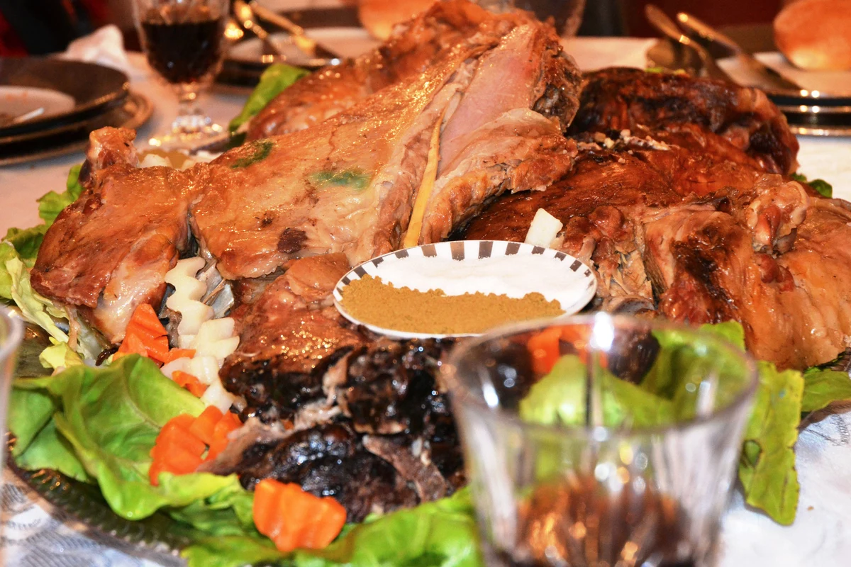 Tender slow-roasted Moroccan Mechoui lamb shoulder served with cumin and salt